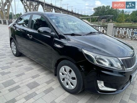 Чорний Кіа Ріо, об'ємом двигуна 1.4 л та пробігом 89 тис. км за 8300 $, фото 1 на Automoto.ua
