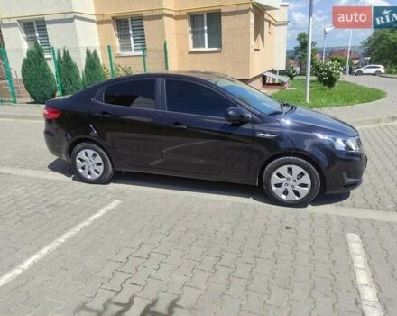 Чорний Кіа Ріо, об'ємом двигуна 1.4 л та пробігом 186 тис. км за 6800 $, фото 1 на Automoto.ua
