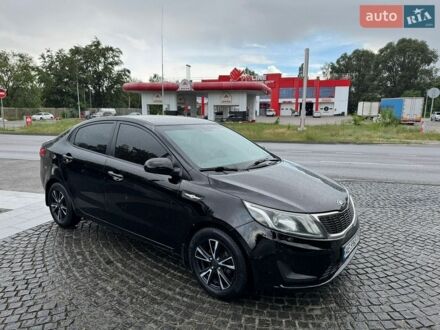 Чорний Кіа Ріо, об'ємом двигуна 1.4 л та пробігом 106 тис. км за 7900 $, фото 1 на Automoto.ua