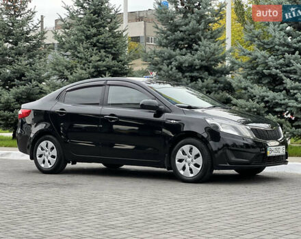 Чорний Кіа Ріо, об'ємом двигуна 1.4 л та пробігом 84 тис. км за 7800 $, фото 1 на Automoto.ua