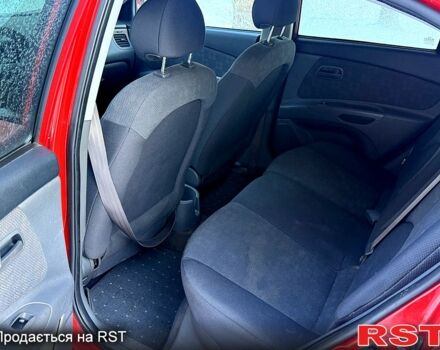 Червоний Кіа Ріо, об'ємом двигуна 1.4 л та пробігом 250 тис. км за 4500 $, фото 9 на Automoto.ua