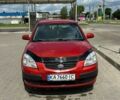 Красный Киа Рио, объемом двигателя 1.4 л и пробегом 257 тыс. км за 5300 $, фото 1 на Automoto.ua