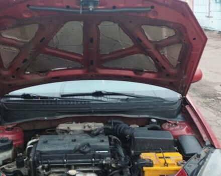 Красный Киа Рио, объемом двигателя 1.4 л и пробегом 275 тыс. км за 4655 $, фото 6 на Automoto.ua