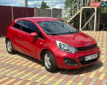 Червоний Кіа Ріо, об'ємом двигуна 1.12 л та пробігом 240 тис. км за 4800 $, фото 1 на Automoto.ua