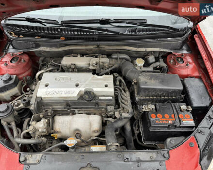 Червоний Кіа Ріо, об'ємом двигуна 1.4 л та пробігом 154 тис. км за 3600 $, фото 15 на Automoto.ua