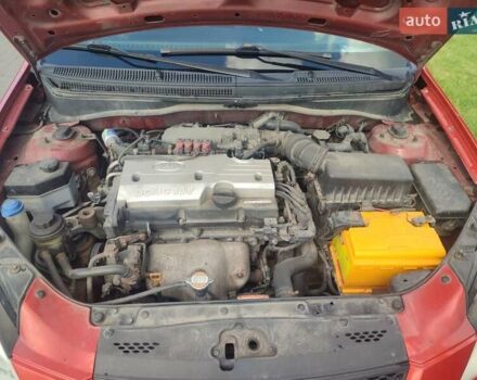 Червоний Кіа Ріо, об'ємом двигуна 1.4 л та пробігом 182 тис. км за 4500 $, фото 16 на Automoto.ua