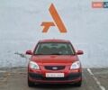 Красный Киа Рио, объемом двигателя 1.4 л и пробегом 100 тыс. км за 6990 $, фото 1 на Automoto.ua