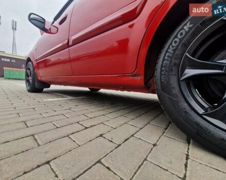 Червоний Кіа Ріо, об'ємом двигуна 1.4 л та пробігом 275 тис. км за 4200 $, фото 1 на Automoto.ua