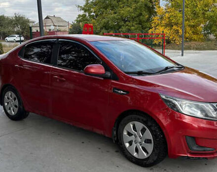 Червоний Кіа Ріо, об'ємом двигуна 1.4 л та пробігом 158 тис. км за 6500 $, фото 1 на Automoto.ua