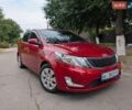 Красный Киа Рио, объемом двигателя 1.4 л и пробегом 181 тыс. км за 6800 $, фото 1 на Automoto.ua