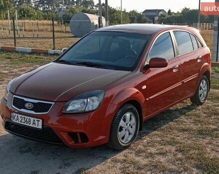 Красный Киа Рио, объемом двигателя 1.4 л и пробегом 213 тыс. км за 6000 $, фото 1 на Automoto.ua