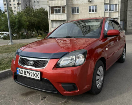 Червоний Кіа Ріо, об'ємом двигуна 1.4 л та пробігом 114 тис. км за 5500 $, фото 1 на Automoto.ua