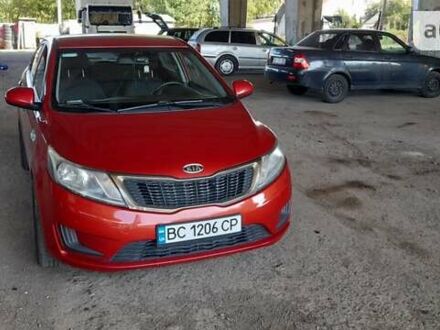 Червоний Кіа Ріо, об'ємом двигуна 1.4 л та пробігом 319 тис. км за 5700 $, фото 1 на Automoto.ua
