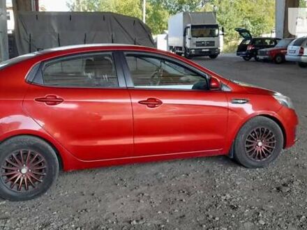 Червоний Кіа Ріо, об'ємом двигуна 1.4 л та пробігом 310 тис. км за 6000 $, фото 1 на Automoto.ua