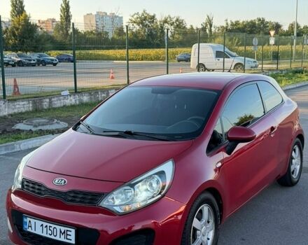 Червоний Кіа Ріо, об'ємом двигуна 1.12 л та пробігом 260 тис. км за 6500 $, фото 1 на Automoto.ua