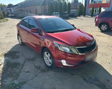 Красный Киа Рио, объемом двигателя 1.6 л и пробегом 169 тыс. км за 7999 $, фото 1 на Automoto.ua