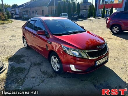 Красный Киа Рио, объемом двигателя 1.6 л и пробегом 159 тыс. км за 8000 $, фото 1 на Automoto.ua