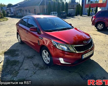 Красный Киа Рио, объемом двигателя 1.6 л и пробегом 159 тыс. км за 8000 $, фото 1 на Automoto.ua