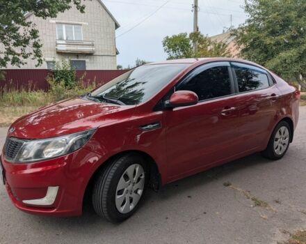Красный Киа Рио, объемом двигателя 1.4 л и пробегом 181 тыс. км за 6822 $, фото 1 на Automoto.ua