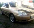 Желтый Киа Рио, объемом двигателя 1.3 л и пробегом 150 тыс. км за 3950 $, фото 1 на Automoto.ua