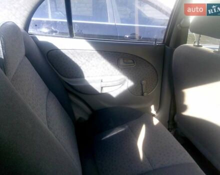 Желтый Киа Рио, объемом двигателя 1.3 л и пробегом 150 тыс. км за 3950 $, фото 4 на Automoto.ua