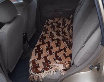 Желтый Киа Рио, объемом двигателя 1.34 л и пробегом 214 тыс. км за 2700 $, фото 2 на Automoto.ua