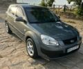 Серый Киа Рио, объемом двигателя 1.4 л и пробегом 245 тыс. км за 4200 $, фото 1 на Automoto.ua