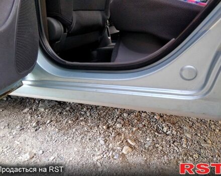 Серый Киа Рио, объемом двигателя 1.4 л и пробегом 225 тыс. км за 4500 $, фото 2 на Automoto.ua