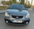 Серый Киа Рио, объемом двигателя 1.4 л и пробегом 209 тыс. км за 4799 $, фото 1 на Automoto.ua
