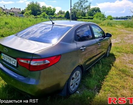 Серый Киа Рио, объемом двигателя 1.4 л и пробегом 235 тыс. км за 5600 $, фото 2 на Automoto.ua