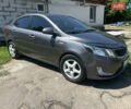 Серый Киа Рио, объемом двигателя 1.6 л и пробегом 250 тыс. км за 8299 $, фото 2 на Automoto.ua
