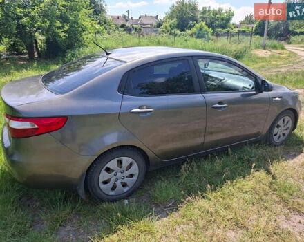Серый Киа Рио, объемом двигателя 1.4 л и пробегом 235 тыс. км за 5600 $, фото 3 на Automoto.ua