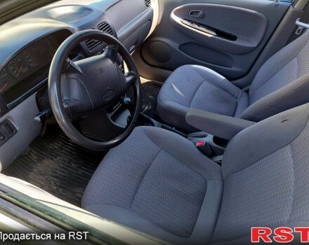 Серый Киа Рио, объемом двигателя 1.5 л и пробегом 100 тыс. км за 1550 $, фото 2 на Automoto.ua