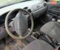 Сірий Кіа Ріо, об'ємом двигуна 1.4 л та пробігом 457 тис. км за 1100 $, фото 5 на Automoto.ua