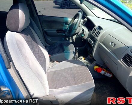 Синій Кіа Ріо, об'ємом двигуна 1.4 л та пробігом 262 тис. км за 2600 $, фото 10 на Automoto.ua