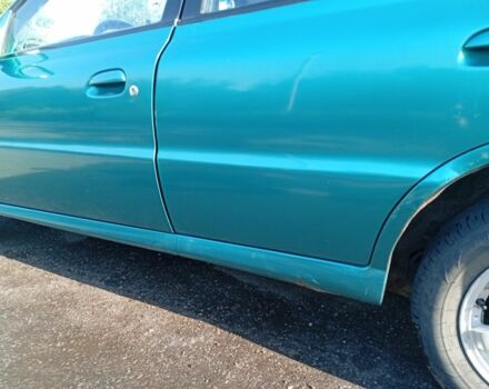 Зеленый Киа Рио, объемом двигателя 1.5 л и пробегом 270 тыс. км за 2600 $, фото 3 на Automoto.ua