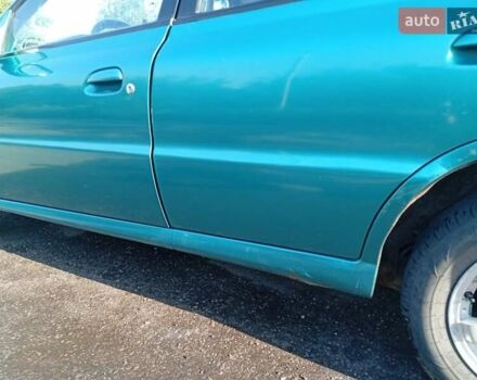 Зеленый Киа Рио, объемом двигателя 1.5 л и пробегом 270 тыс. км за 2600 $, фото 2 на Automoto.ua