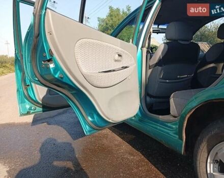 Зеленый Киа Рио, объемом двигателя 1.5 л и пробегом 270 тыс. км за 2600 $, фото 9 на Automoto.ua