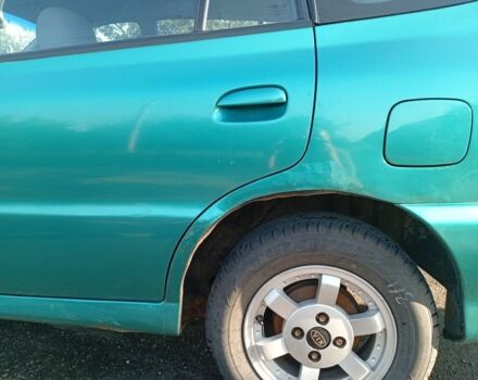 Зеленый Киа Рио, объемом двигателя 1.5 л и пробегом 270 тыс. км за 2600 $, фото 4 на Automoto.ua