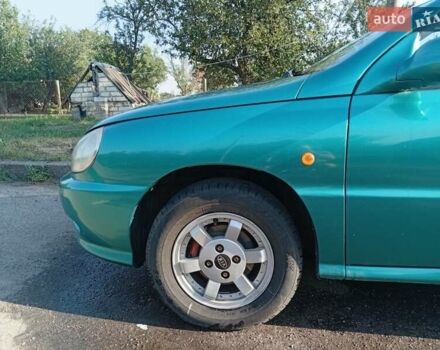 Зеленый Киа Рио, объемом двигателя 1.5 л и пробегом 270 тыс. км за 2600 $, фото 5 на Automoto.ua