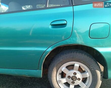 Зеленый Киа Рио, объемом двигателя 1.5 л и пробегом 270 тыс. км за 2600 $, фото 3 на Automoto.ua