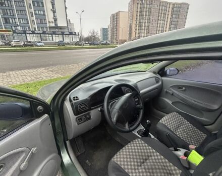 Зеленый Киа Рио, объемом двигателя 1.5 л и пробегом 235 тыс. км за 2600 $, фото 6 на Automoto.ua