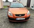 Оранжевый Киа Рио, объемом двигателя 1.4 л и пробегом 150 тыс. км за 4200 $, фото 1 на Automoto.ua