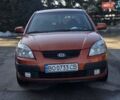 Оранжевый Киа Рио, объемом двигателя 1.4 л и пробегом 232 тыс. км за 3999 $, фото 2 на Automoto.ua