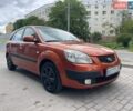 Оранжевый Киа Рио, объемом двигателя 1.4 л и пробегом 234 тыс. км за 3850 $, фото 1 на Automoto.ua