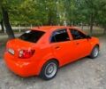 Оранжевый Киа Рио, объемом двигателя 1.4 л и пробегом 235 тыс. км за 4100 $, фото 3 на Automoto.ua