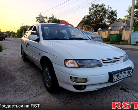 Белый Киа Сефия, объемом двигателя 1.6 л и пробегом 327 тыс. км за 1199 $, фото 1 на Automoto.ua