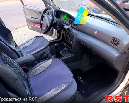 Белый Киа Сефия, объемом двигателя 1.6 л и пробегом 327 тыс. км за 1199 $, фото 10 на Automoto.ua