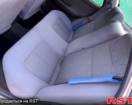 Белый Киа Сефия, объемом двигателя 1.6 л и пробегом 327 тыс. км за 1199 $, фото 9 на Automoto.ua