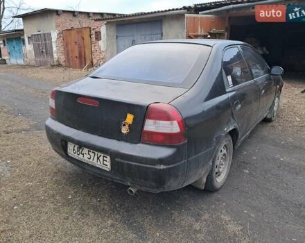 Чорний Кіа Сефія, об'ємом двигуна 1.5 л та пробігом 300 тис. км за 1200 $, фото 4 на Automoto.ua